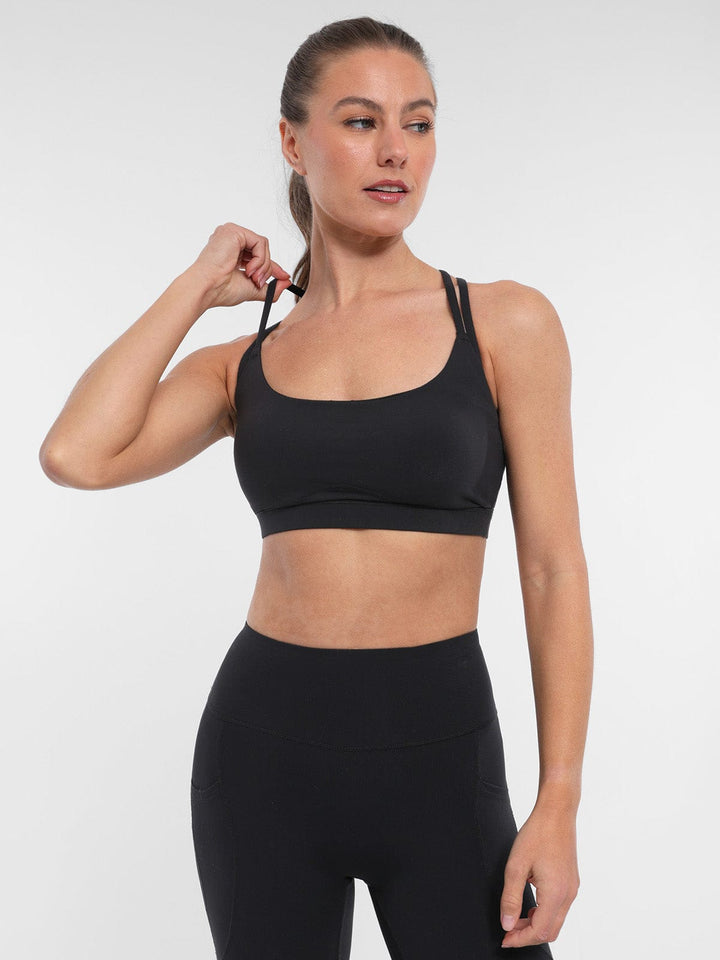 A model wearing a BRXL® BrxlZero™ Cross Back Strappy Sports Bra in