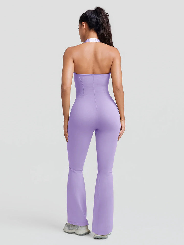 A model wearing a BRXL® BrxlZero® Halter Neck Sculpt Seamless Flare Jumpsuit