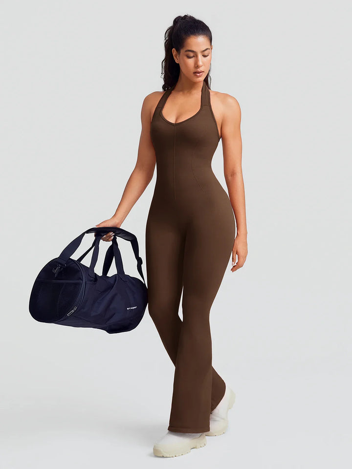 A model wearing a BRXL® BrxlZero® Halter Neck Sculpt Seamless Flare Jumpsuit