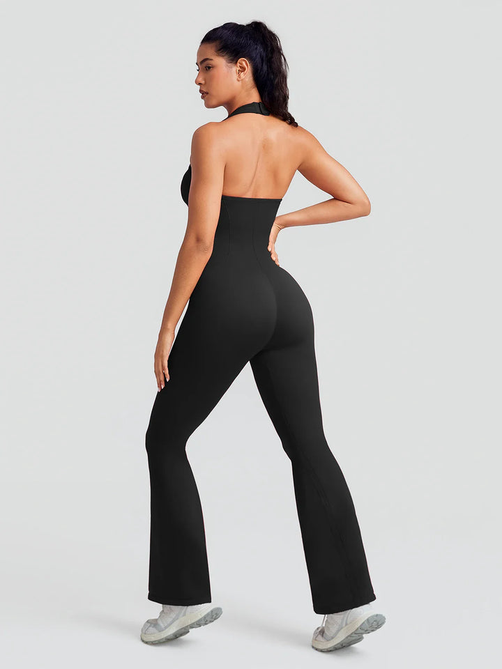 A model wearing a BRXL® BrxlZero® Halter Neck Sculpt Seamless Flare Jumpsuit