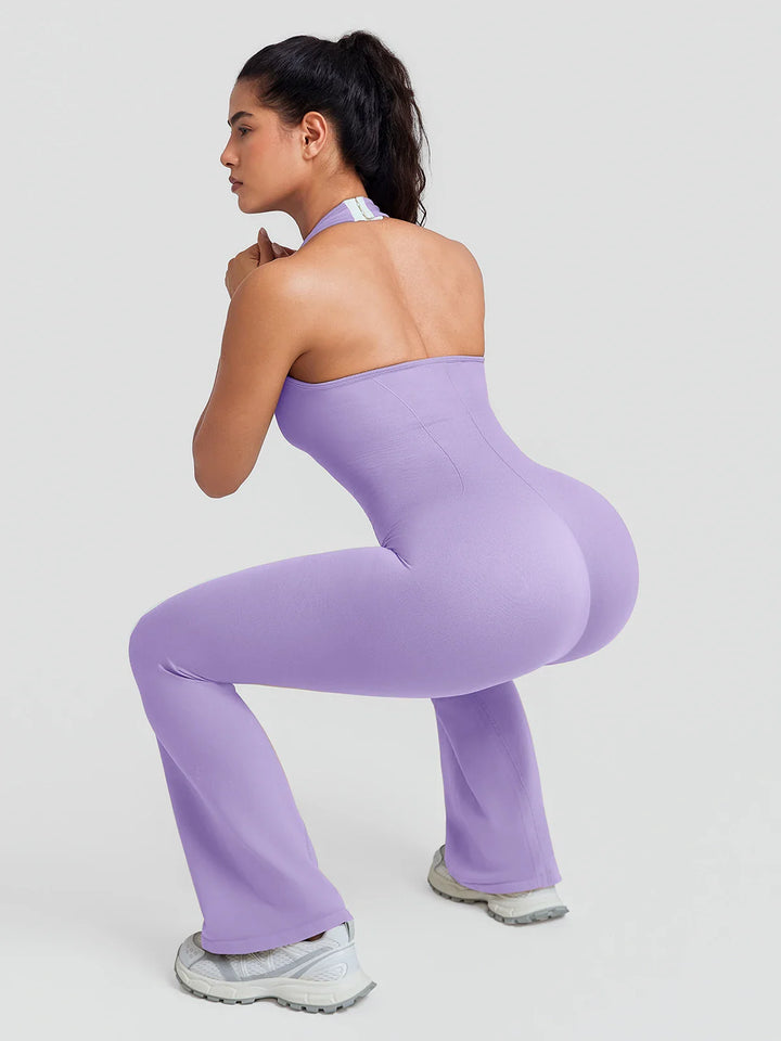 A model wearing a BRXL® BrxlZero® Halter Neck Sculpt Seamless Flare Jumpsuit