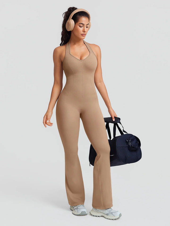 A model wearing a BRXL® BrxlZero® Halter Neck Sculpt Seamless Flare Jumpsuit