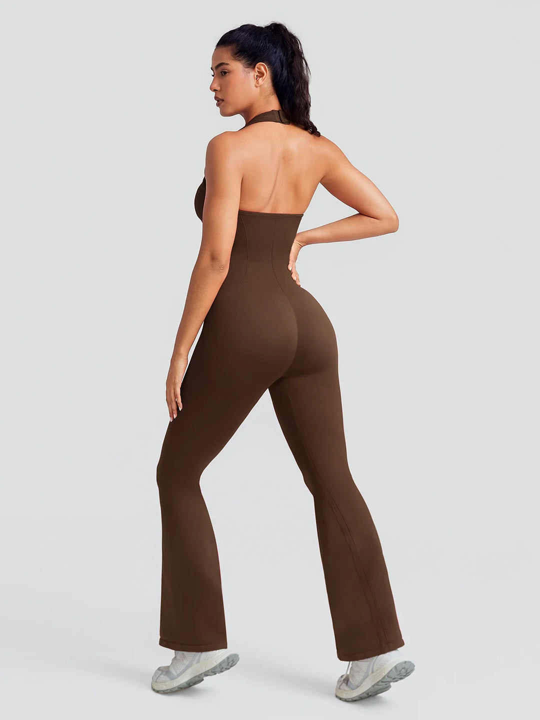 A model wearing a BRXL® BrxlZero® Halter Neck Sculpt Seamless Flare Jumpsuit