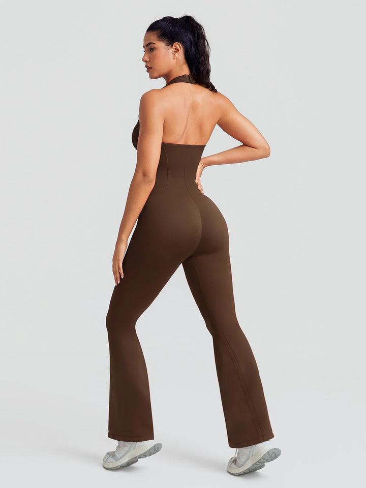 A model wearing a BRXL® BrxlZero® Halter Neck Sculpt Seamless Flare Jumpsuit