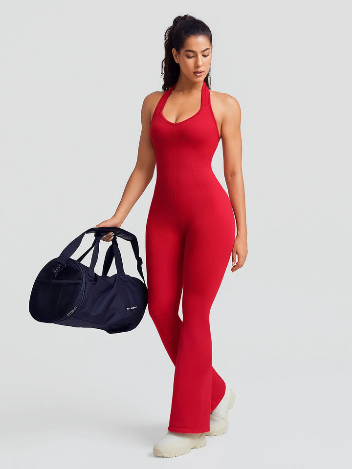 A model wearing a BRXL® BrxlZero® Halter Neck Sculpt Seamless Flare Jumpsuit