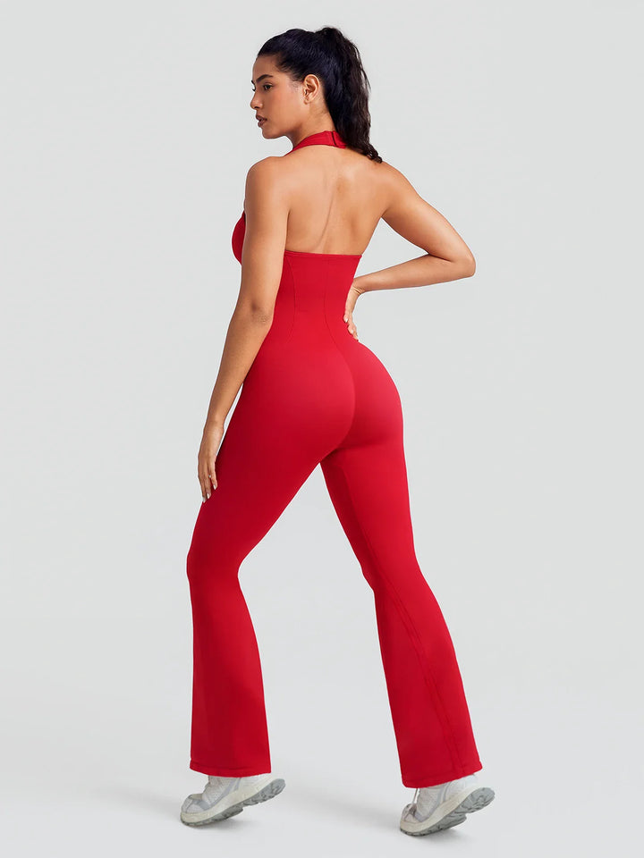 A model wearing a BRXL® BrxlZero® Halter Neck Sculpt Seamless Flare Jumpsuit
