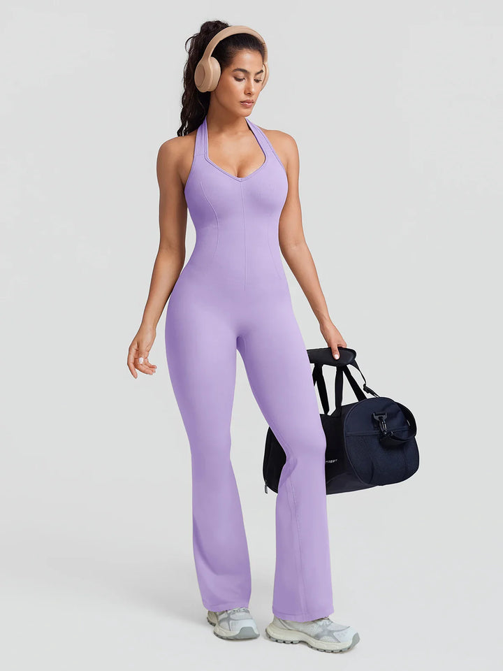A model wearing a BRXL® BrxlZero® Halter Neck Sculpt Seamless Flare Jumpsuit