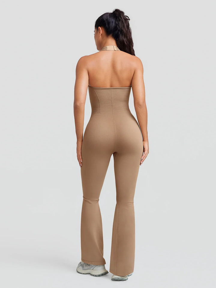 A model wearing a BRXL® BrxlZero® Halter Neck Sculpt Seamless Flare Jumpsuit