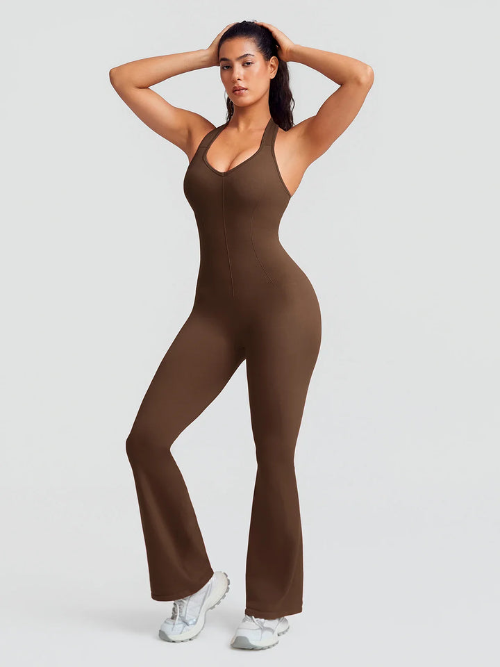 A model wearing a BRXL® BrxlZero® Halter Neck Sculpt Seamless Flare Jumpsuit Coffee Brown / XS