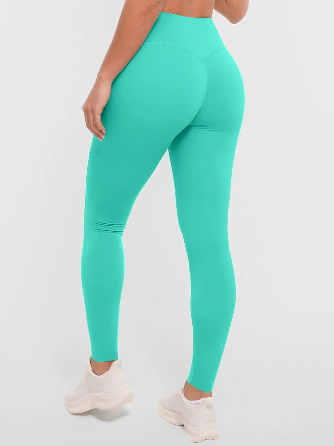 A model wearing a BRXL® BrxlZero™ High Rise Buttery Soft Yoga Leggings in