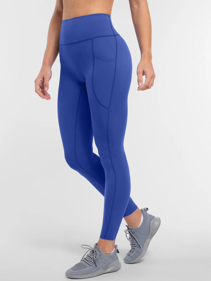 A model wearing a BRXL® BrxlZero™ High Rise Buttery Soft Yoga Leggings in