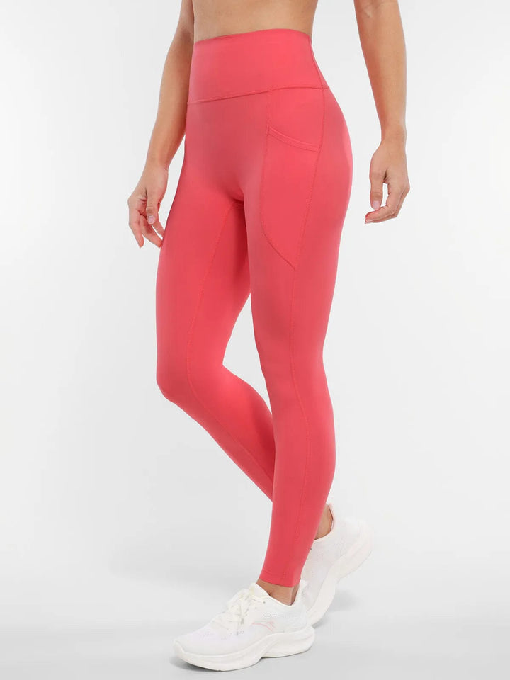 A model wearing a BRXL® BrxlZero™ High Rise Buttery Soft Yoga Leggings in