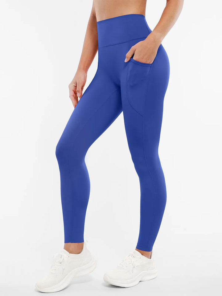 A model wearing a BRXL® BrxlZero™ High Rise Buttery Soft Yoga Leggings in Blue / XS