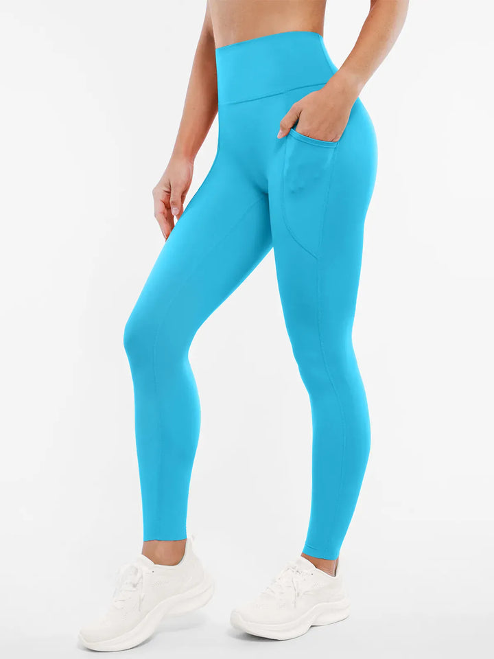A model wearing a BRXL® BrxlZero™ High Rise Buttery Soft Yoga Leggings in Light Blue / XS