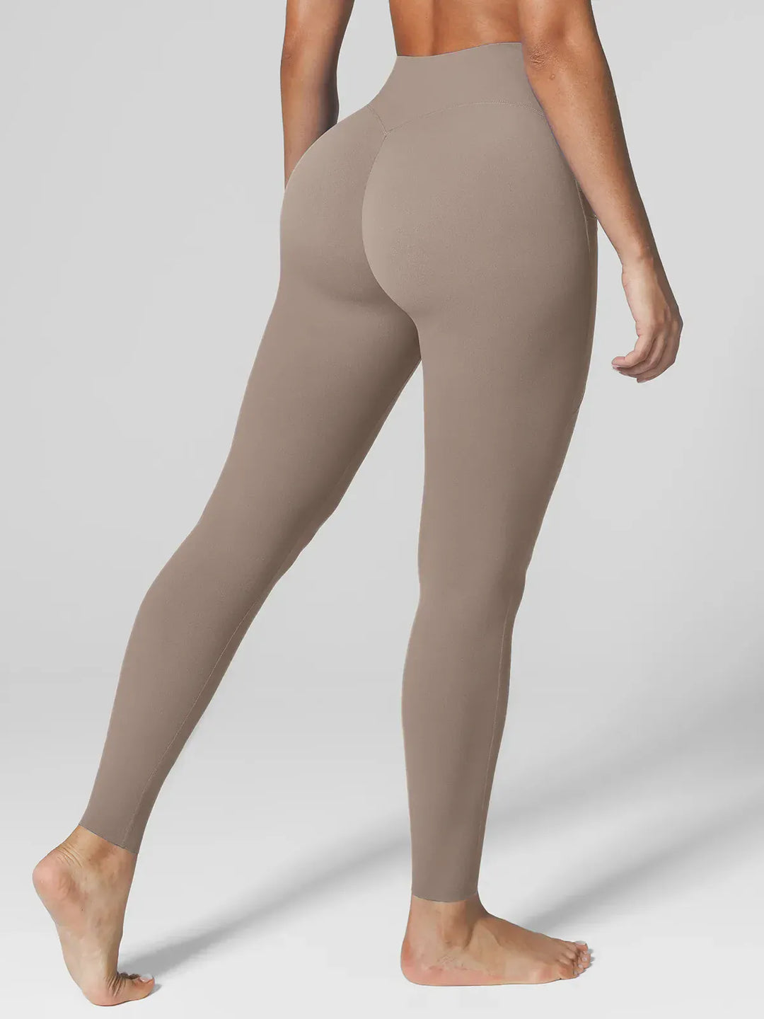A model wearing a BRXL® BrxlZero™ High Rise Side Pockets Buttery Soft Yoga Leggings