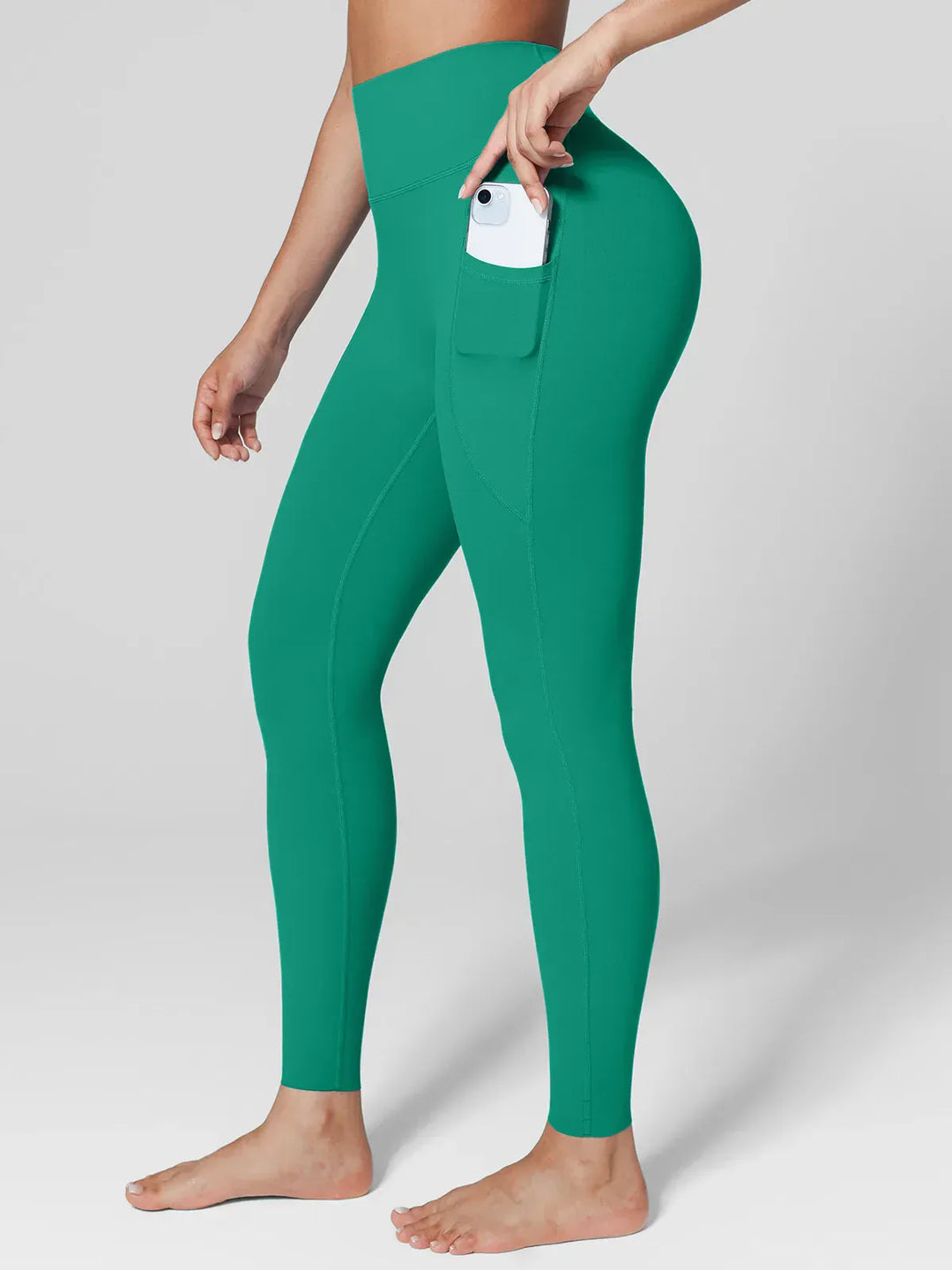 A model wearing a BRXL® BrxlZero™ High Rise Side Pockets Buttery Soft Yoga Leggings