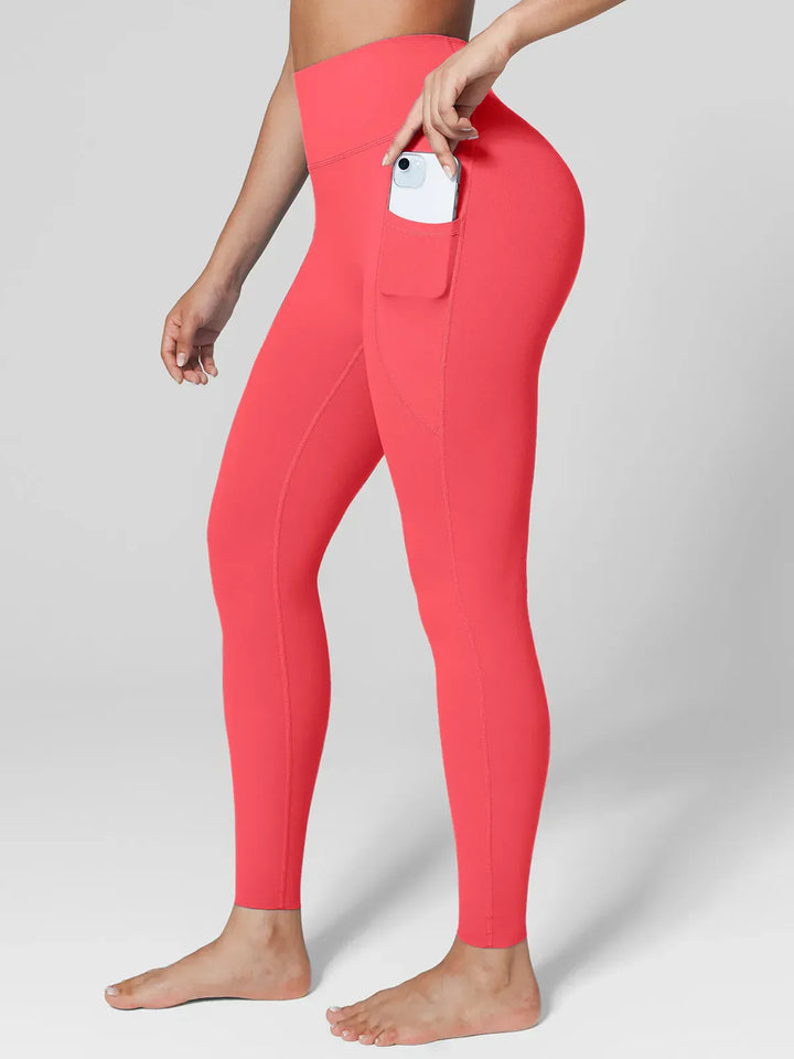 A model wearing a BRXL® BrxlZero™ High Rise Side Pockets Buttery Soft Yoga Leggings in