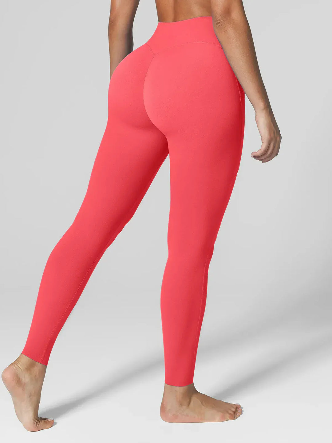 A model wearing a BRXL® BrxlZero™ High Rise Side Pockets Buttery Soft Yoga Leggings