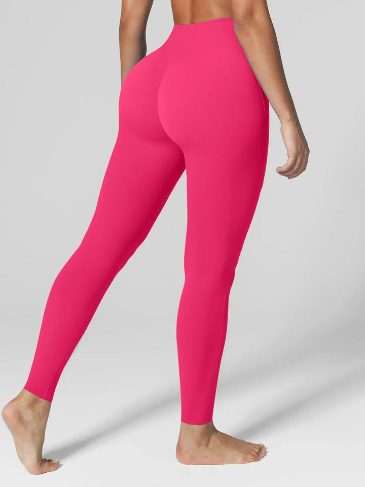 A model wearing a BRXL® BrxlZero™ High Rise Side Pockets Buttery Soft Yoga Leggings