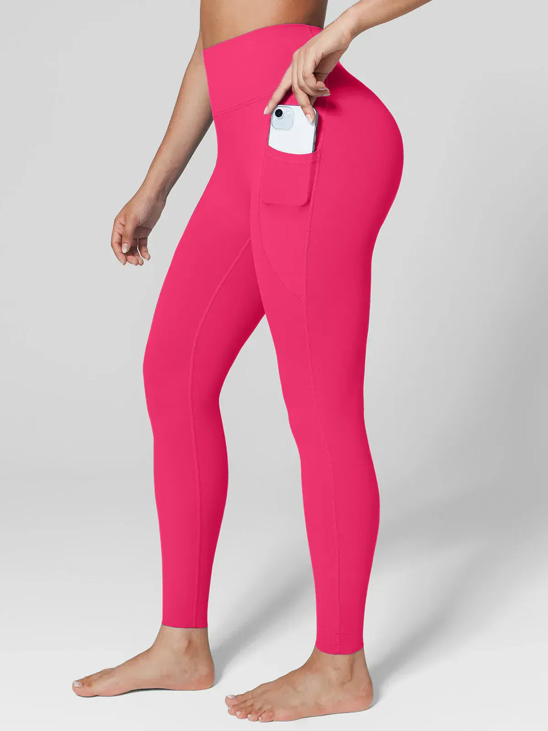 A model wearing a BRXL® BrxlZero™ High Rise Side Pockets Buttery Soft Yoga Leggings