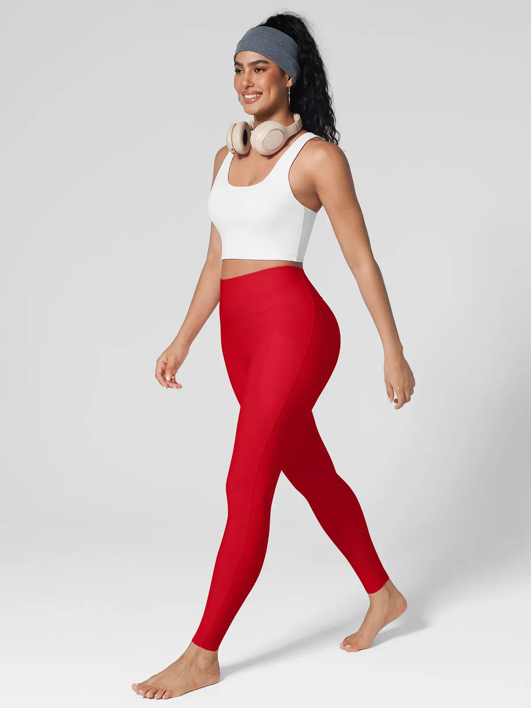 A model wearing a BRXL® BrxlZero™ High Rise Side Pockets Buttery Soft Yoga Leggings in