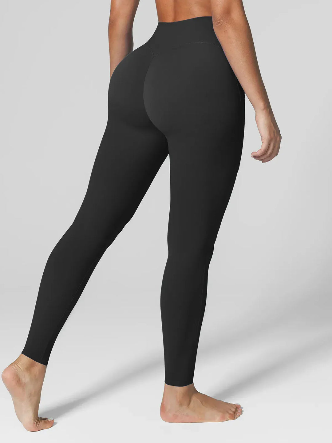 A model wearing a BRXL® BrxlZero™ High Rise Side Pockets Buttery Soft Yoga Leggings in