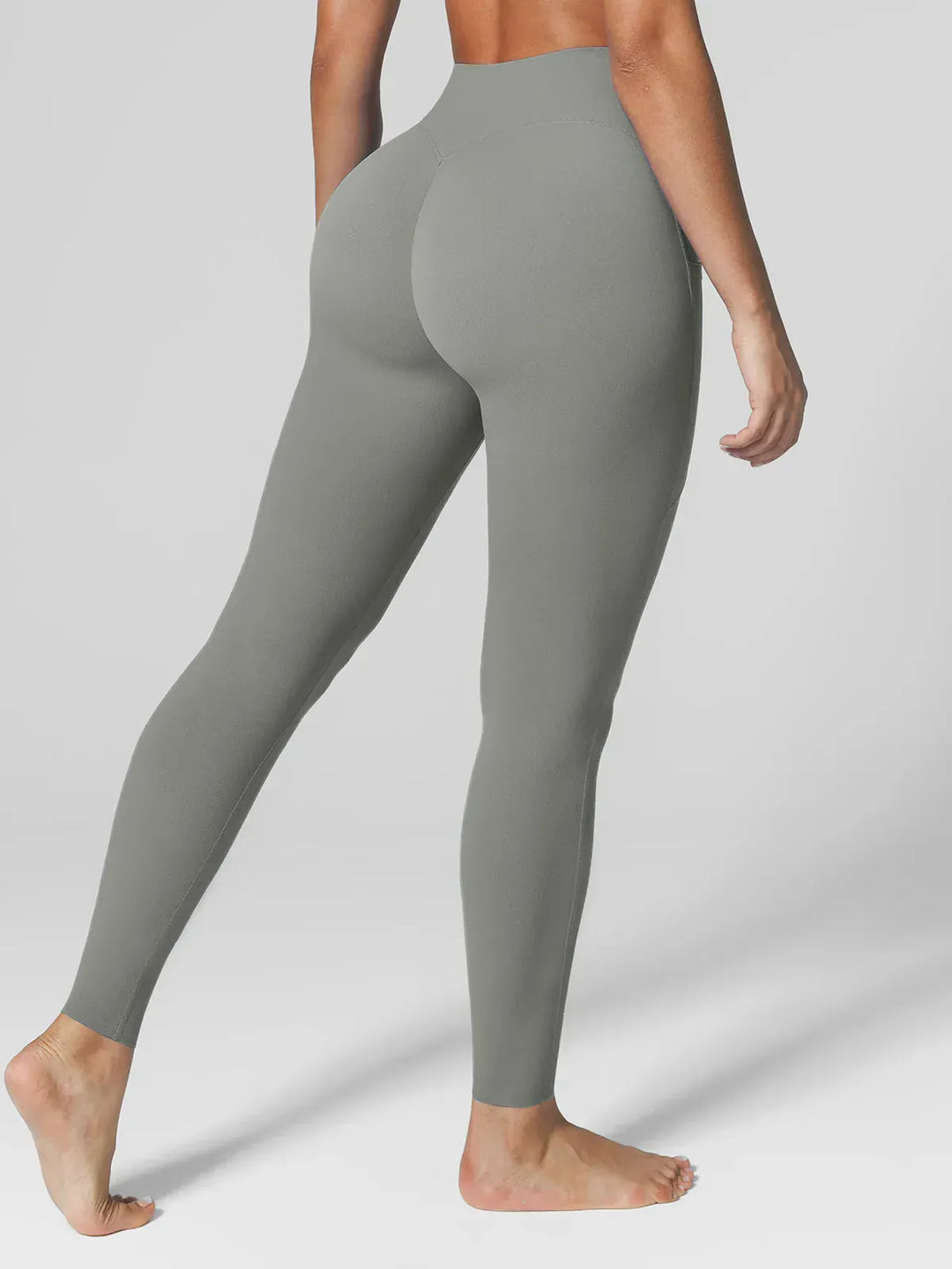 A model wearing a BRXL® BrxlZero™ High Rise Side Pockets Buttery Soft Yoga Leggings