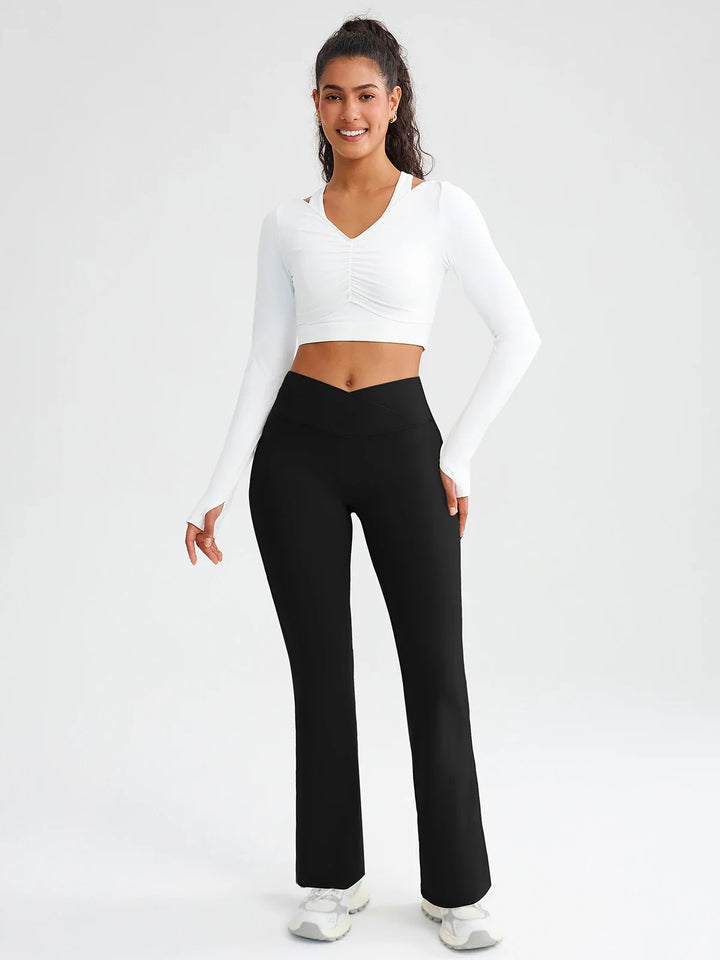 A model wearing a BRXL® BrxlZero® Off Shoulder Long Sleeve Crop Top with Built-In Bra