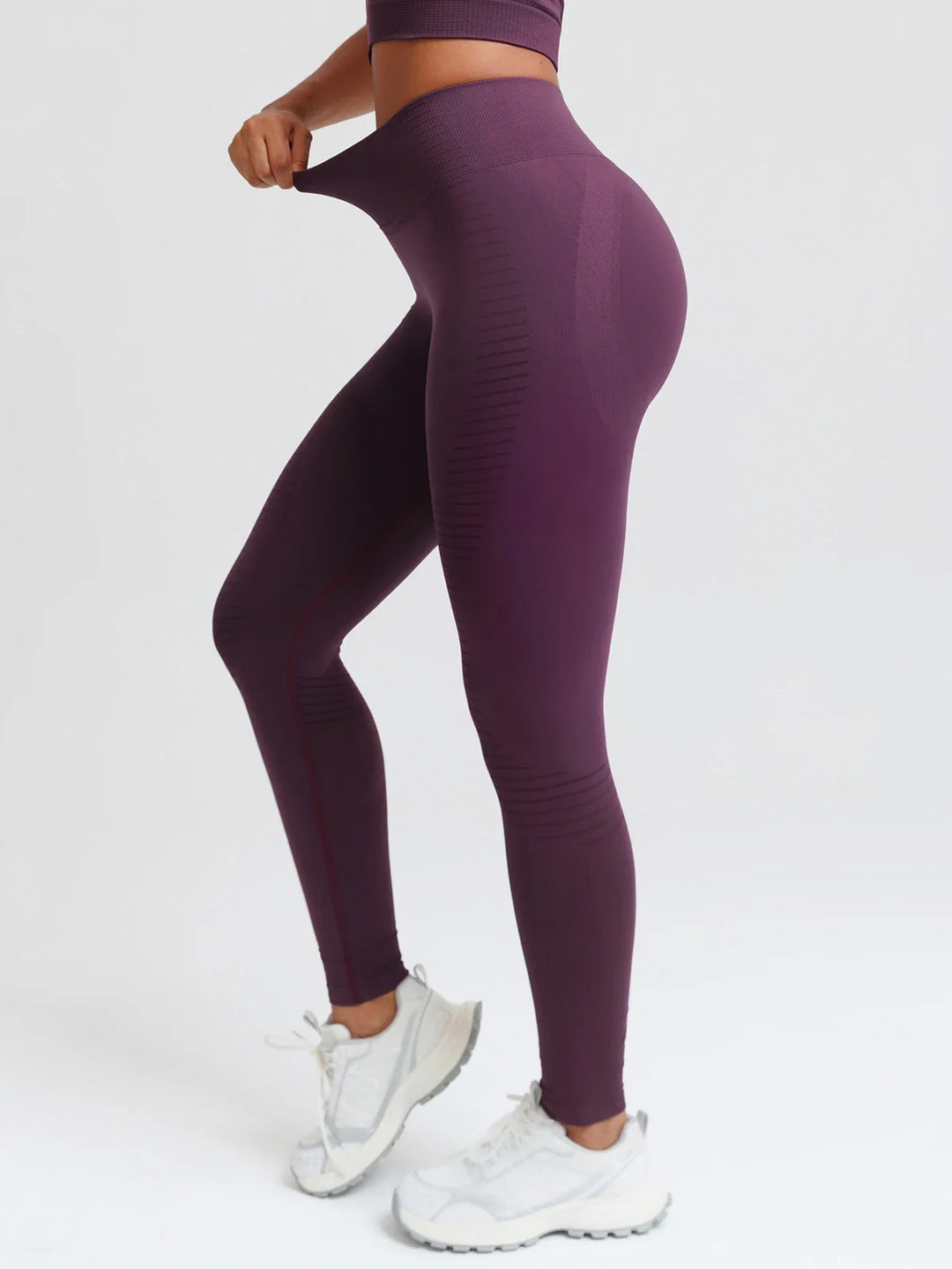 A model wearing a BRXL® BrxlZero® Seamless Butt Lifting Workout Leggings with Calf Support
