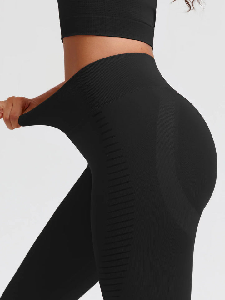 A model wearing a BRXL® BrxlZero® Seamless Butt Lifting Workout Leggings with Calf Support