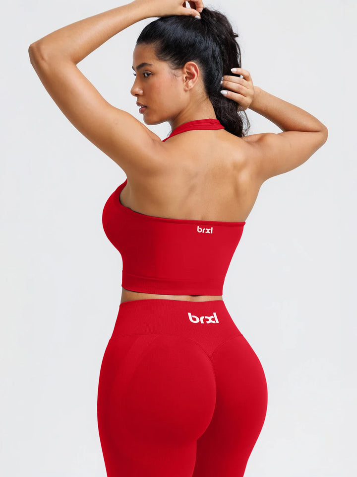 A model wearing a BRXL® BrxlZero® Seamless Ribbed Scoop-Neck Halter Sports Tank Top