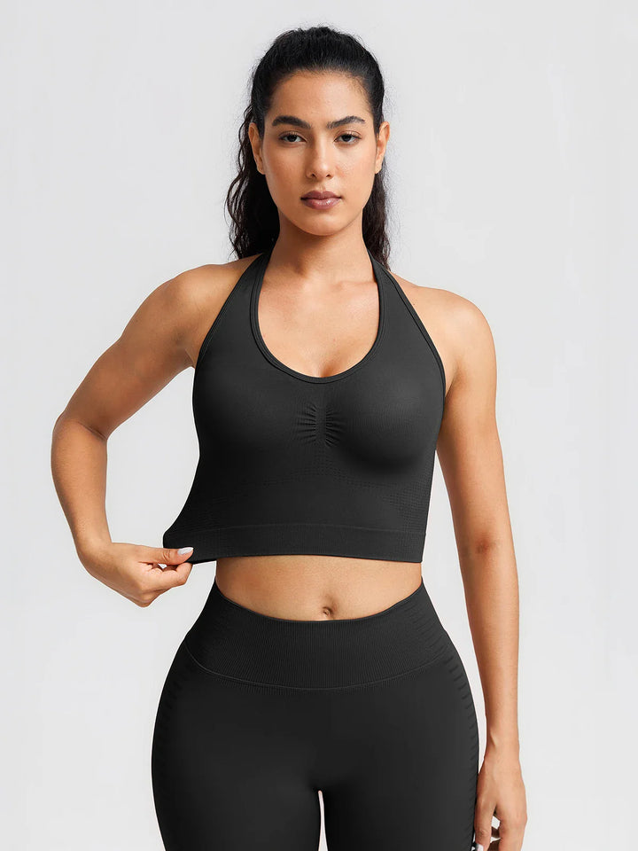A model wearing a BRXL® BrxlZero® Seamless Ribbed Scoop-Neck Halter Sports Tank Top
