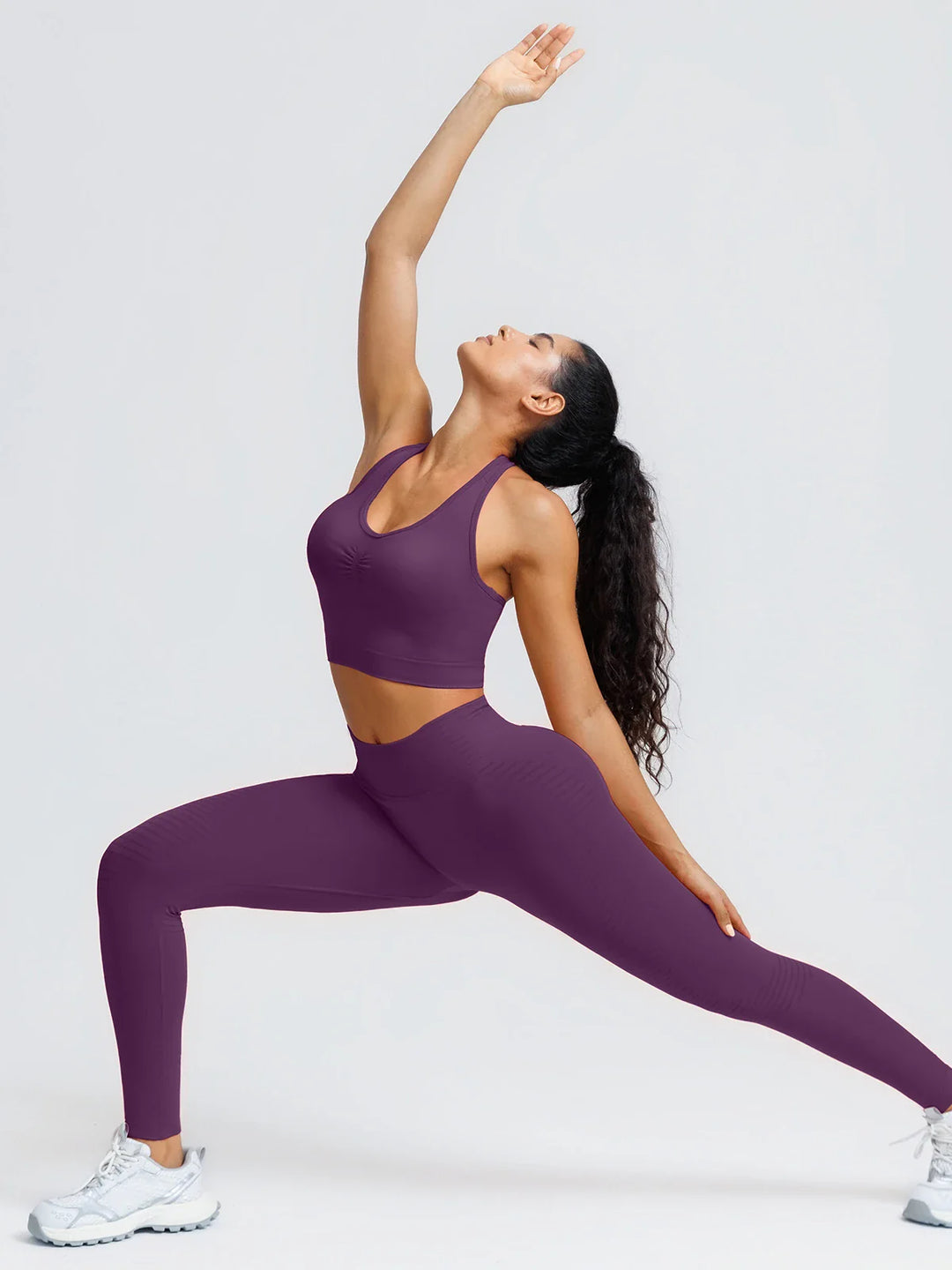 A model wearing a BRXL® BrxlZero® Seamless Ribbed Scoop-Neck Halter Sports Tank Top