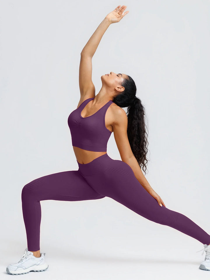 A model wearing a BRXL® BrxlZero® Seamless Ribbed Scoop-Neck Halter Sports Tank Top