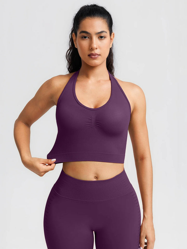 A model wearing a BRXL® BrxlZero® Seamless Ribbed Scoop-Neck Halter Sports Tank Top