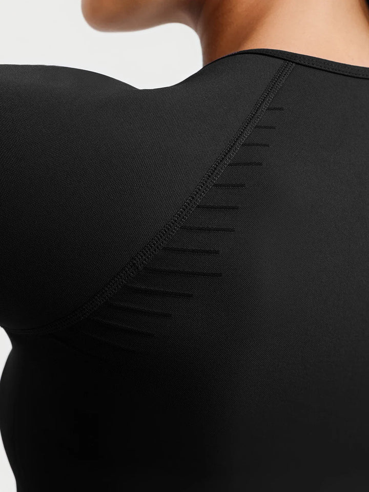 A model wearing a BRXL® BrxlZero® Seamless Scoop-Neck Long Sleeve Cropped Jacket