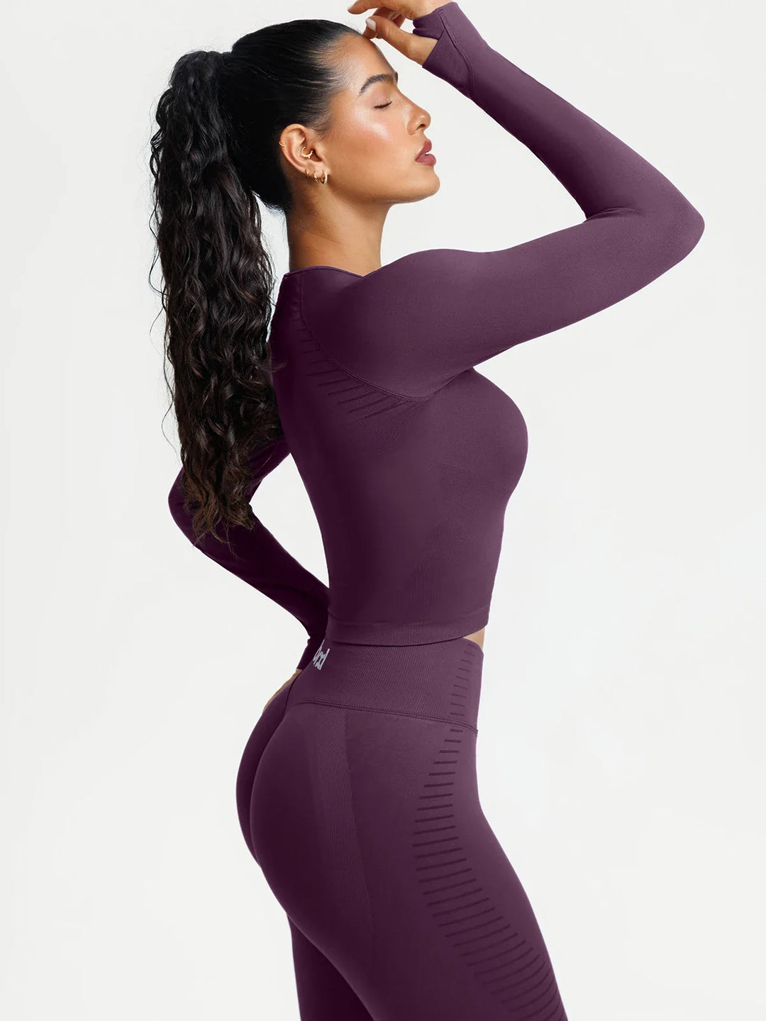 A model wearing a BRXL® BrxlZero® Seamless Scoop-Neck Long Sleeve Cropped Jacket