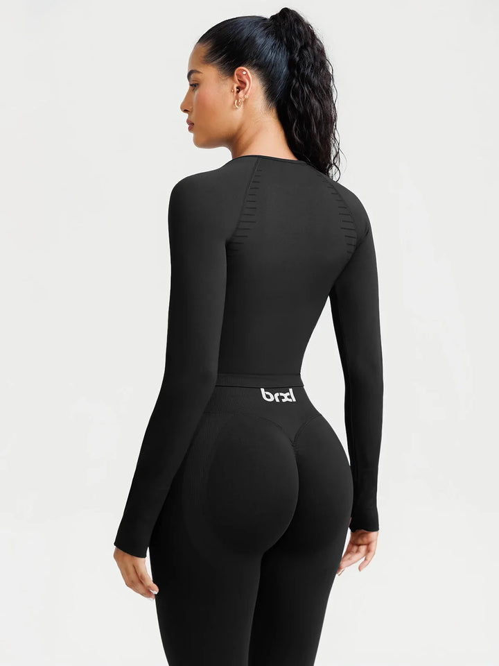 A model wearing a BRXL® BrxlZero® Seamless Scoop-Neck Long Sleeve Cropped Jacket