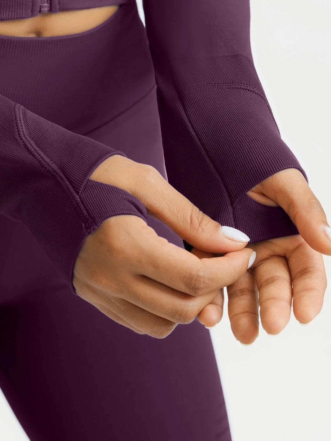 A model wearing a BRXL® BrxlZero® Seamless Scoop-Neck Long Sleeve Cropped Jacket