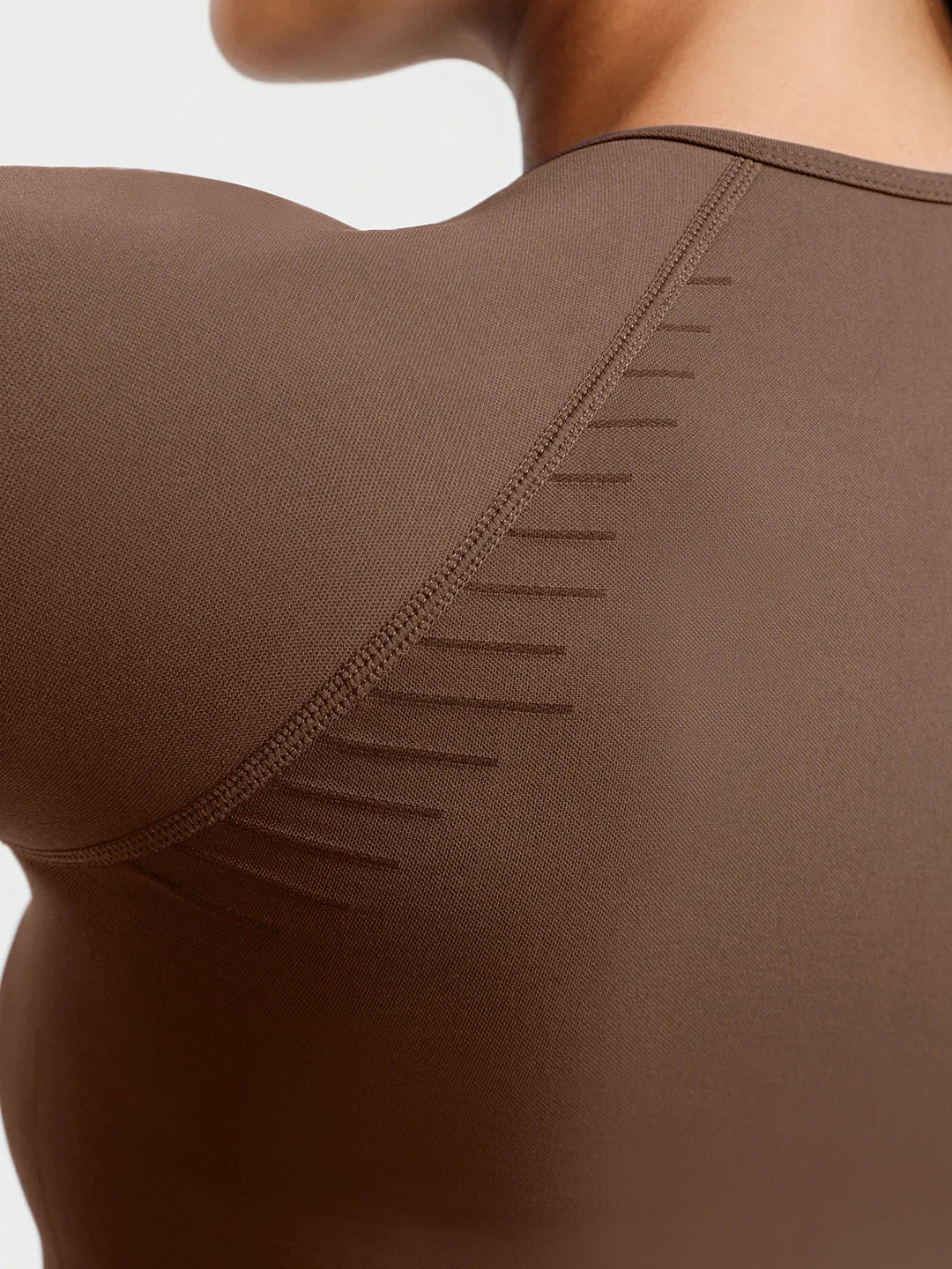 A model wearing a BRXL® BrxlZero® Seamless Scoop-Neck Long Sleeve Cropped Jacket