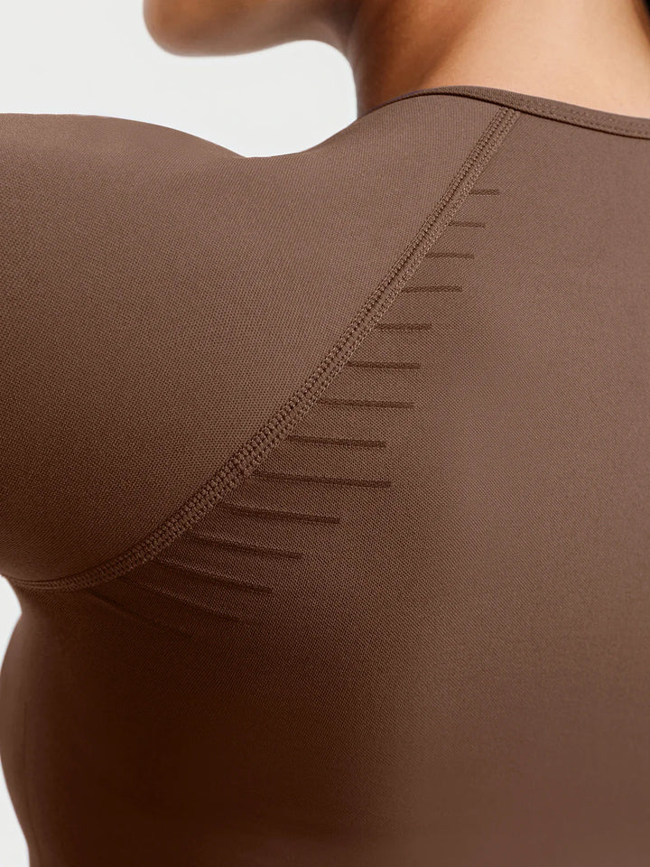 A model wearing a BRXL® BrxlZero® Seamless Scoop-Neck Long Sleeve Cropped Jacket