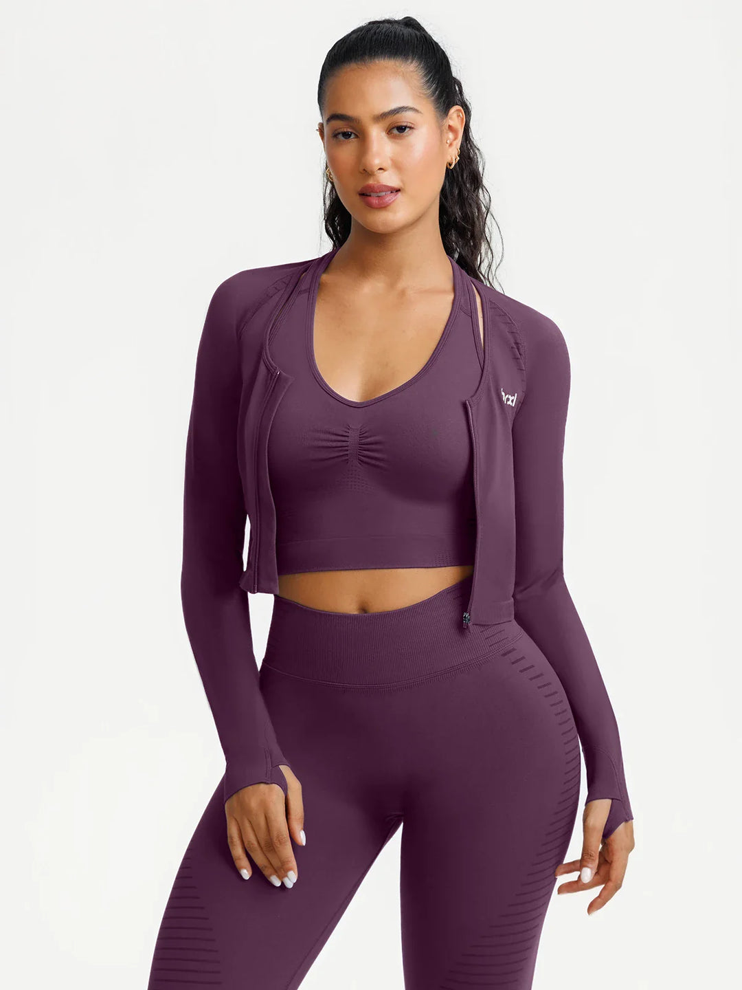 A model wearing a BRXL® BrxlZero® Seamless Scoop-Neck Long Sleeve Cropped Jacket