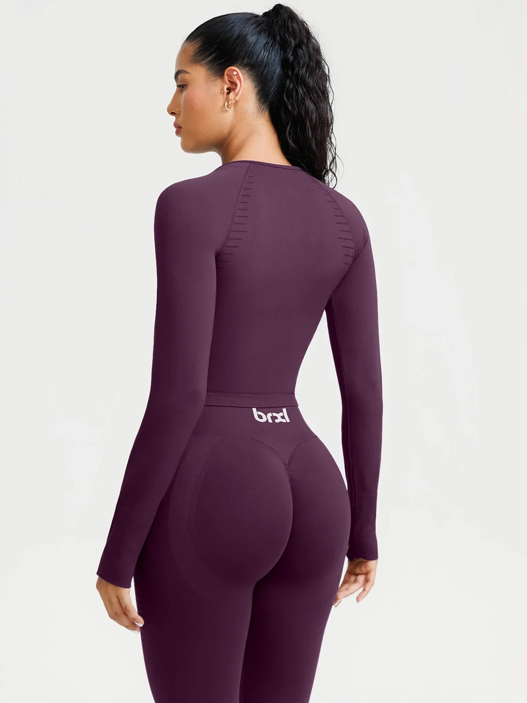 A model wearing a BRXL® BrxlZero® Seamless Scoop-Neck Long Sleeve Cropped Jacket