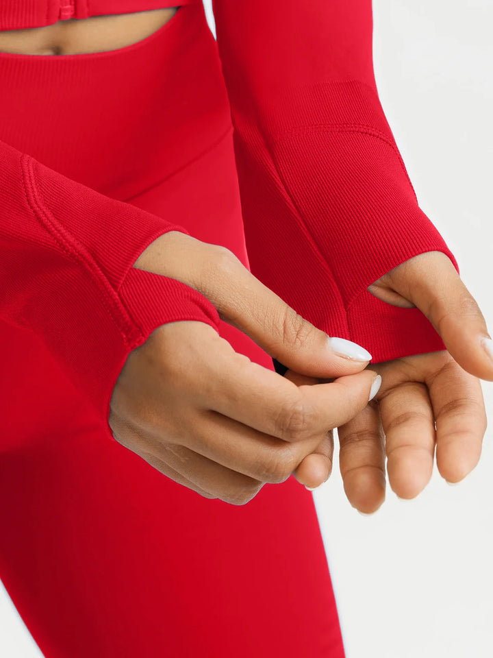 A model wearing a BRXL® BrxlZero® Seamless Scoop-Neck Long Sleeve Cropped Jacket