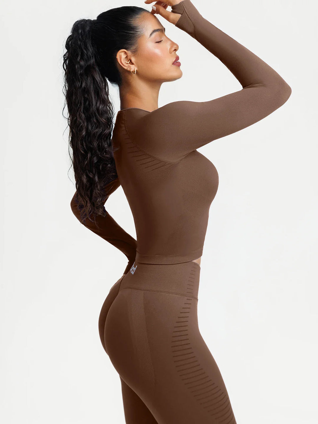 A model wearing a BRXL® BrxlZero® Seamless Scoop-Neck Long Sleeve Cropped Jacket