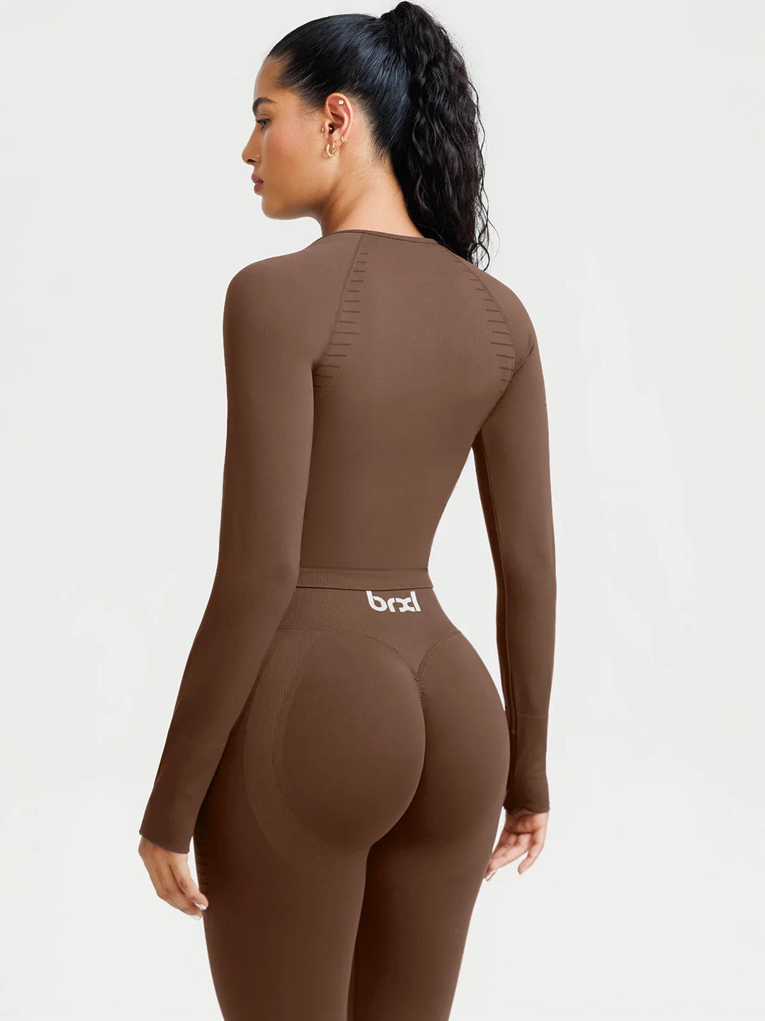A model wearing a BRXL® BrxlZero® Seamless Scoop-Neck Long Sleeve Cropped Jacket
