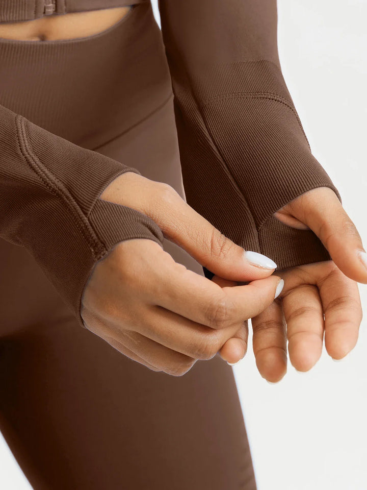 A model wearing a BRXL® BrxlZero® Seamless Scoop-Neck Long Sleeve Cropped Jacket