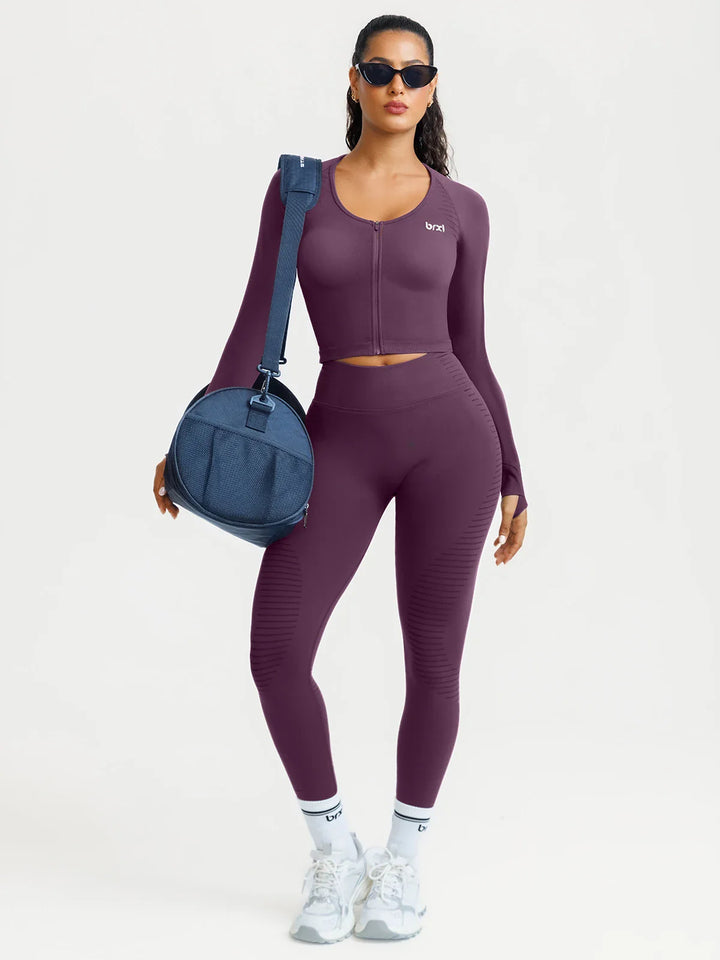 A model wearing a BRXL® BrxlZero® Seamless Scoop-Neck Long Sleeve Cropped Jacket