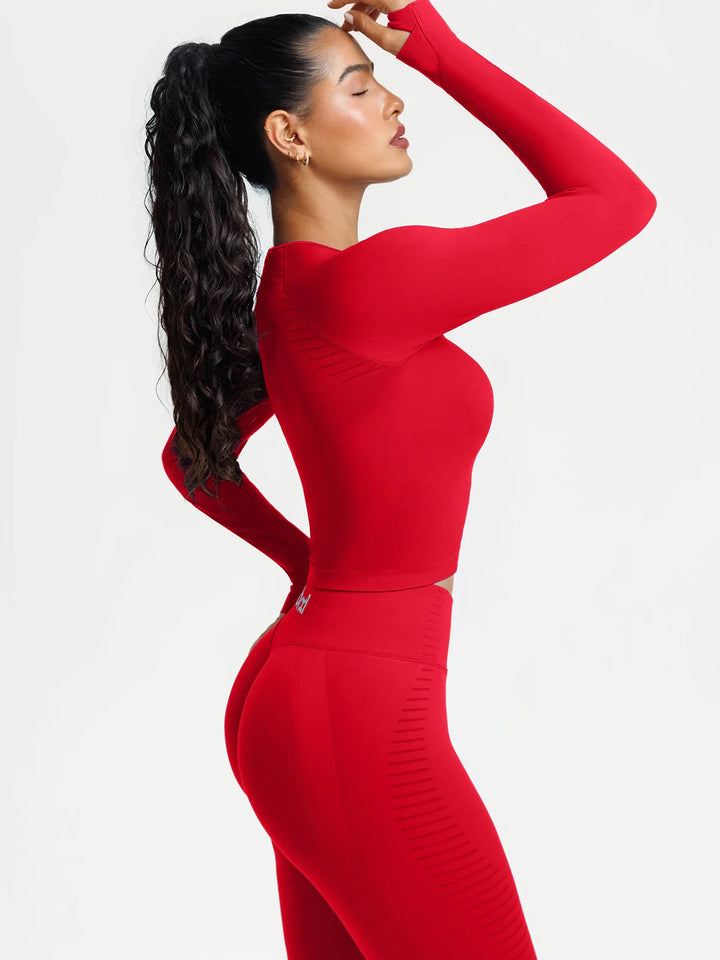 A model wearing a BRXL® BrxlZero® Seamless Scoop-Neck Long Sleeve Cropped Jacket