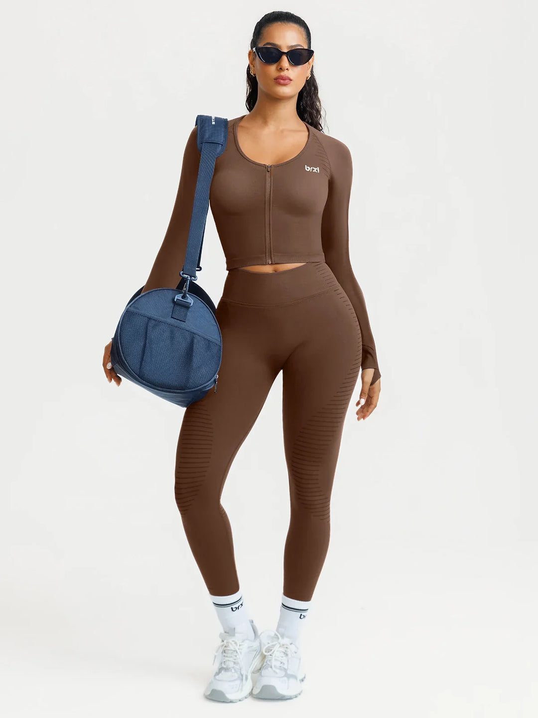 A model wearing a BRXL® BrxlZero® Seamless Scoop-Neck Long Sleeve Cropped Jacket